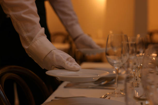 istock Woman setting table in restaurant, closeup. Professional butler courses 1743494952