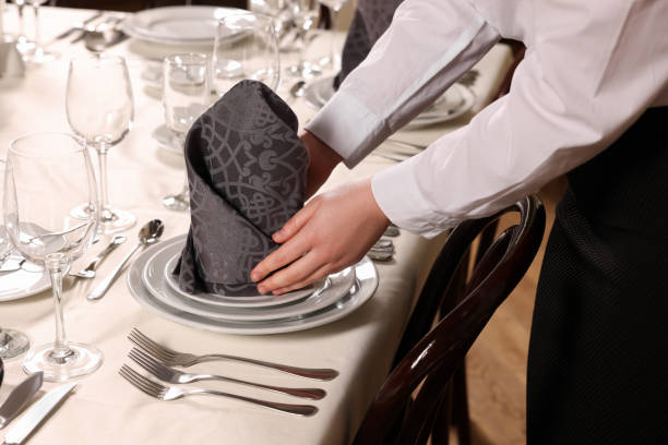 istock Woman setting table in restaurant, closeup. Professional butler courses 1743498858