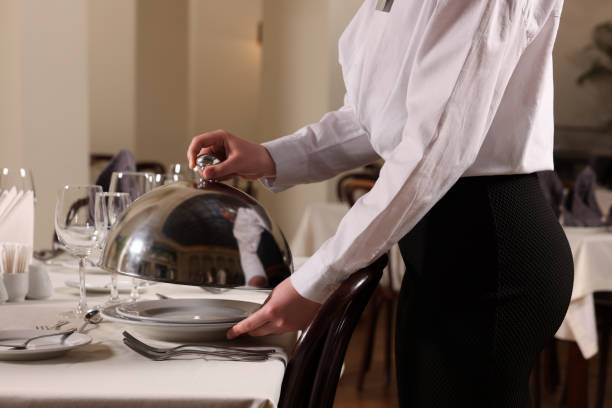istock Woman setting table in restaurant, closeup. Professional butler courses 1743498859