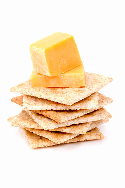 istock Orange cheese cubes on stacked crackers 174350380
