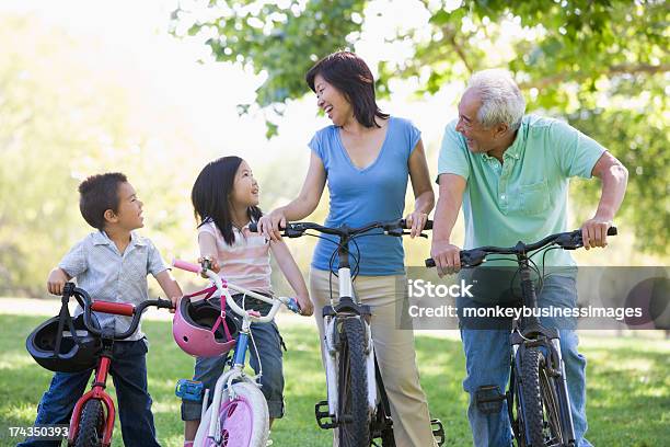 Grandparents Bike Riding With Grandchildren Stock Photo - Download Image Now - Japanese Ethnicity, Cycling, Bicycle