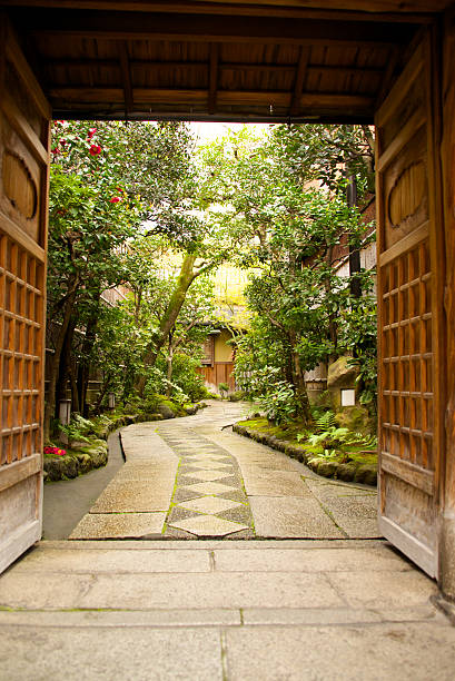 istock View through wooden doors into Japanese garden 174351153
