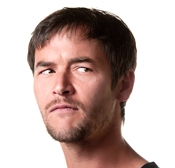 istock Young Man With Questioning Expression of Suspicion 174351325