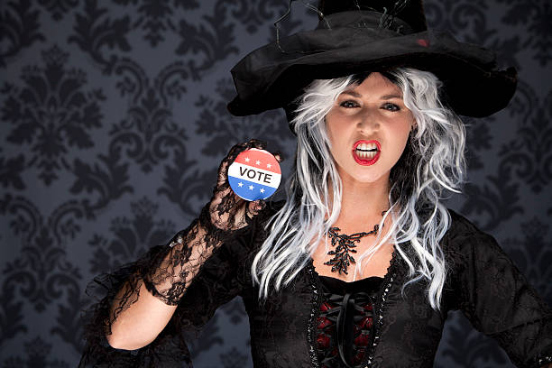 Witch with vote for the best costume button