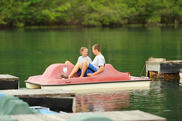 istock Two children taking out pedal boat 174354063