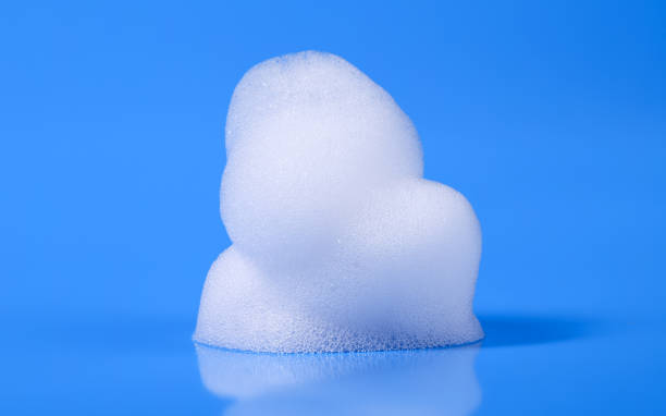 istock foam soap bubble, shampoo liquid texture isolated blue background 1743557936