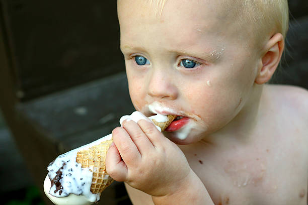 Messy Baby Eating Ice Cream Cone