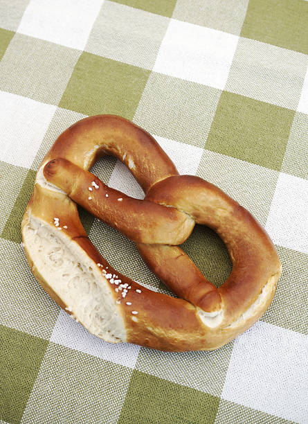 istock German Brezel on green and white tablecloth 174356698