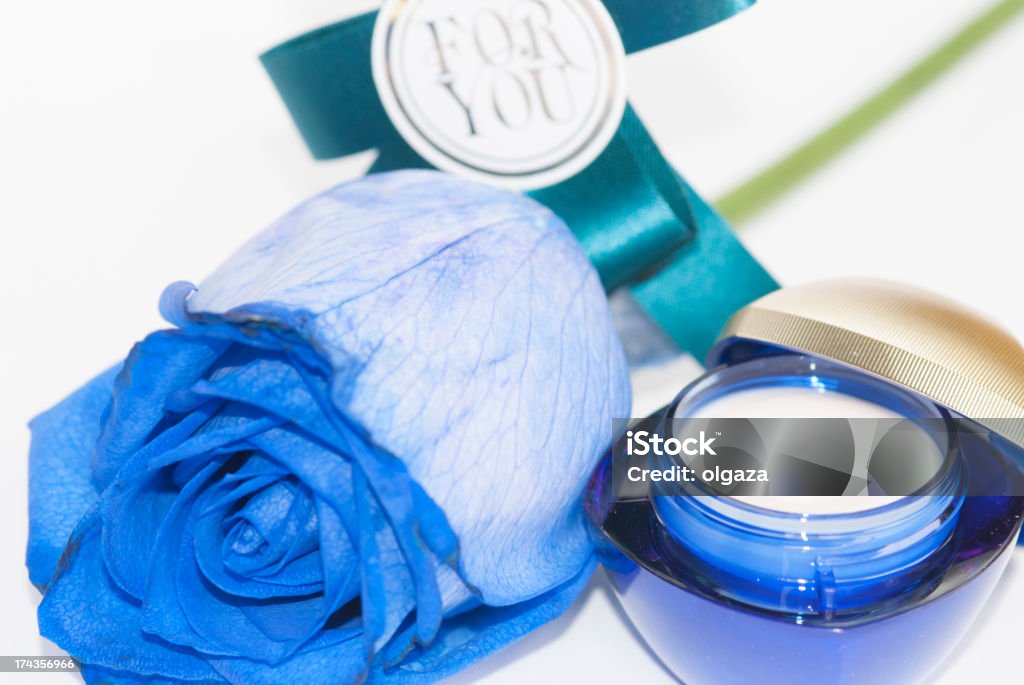 Blue gift Rose and cream as gift Beauty Treatment Stock Photo