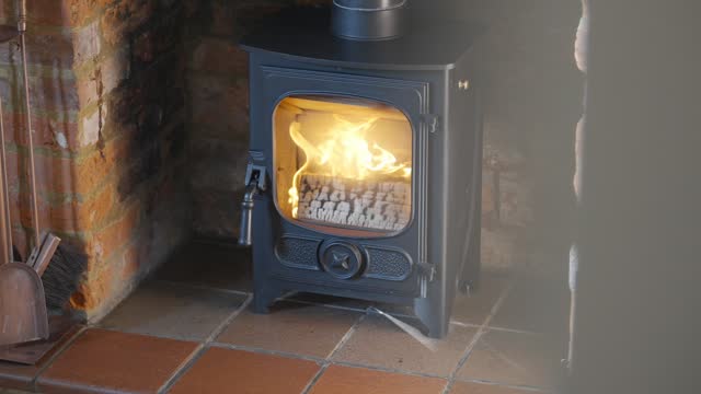 Fire burning in wood burning stove