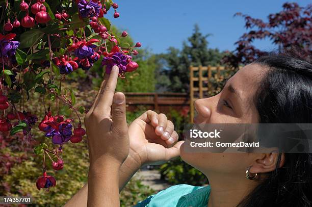 A Pretty Woman Shopping For Plants Stock Photo - Download Image Now - 20-29 Years, Adult, Adults Only