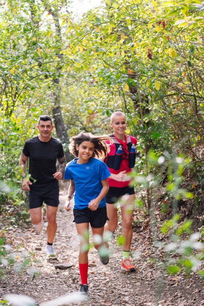 istock family practicing trail running through the woods 1743610923