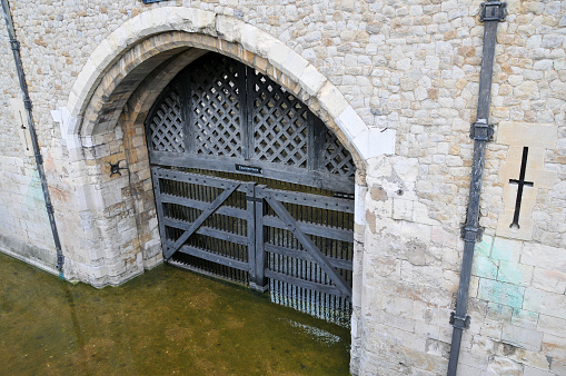 Traitors' Gate is a watergate entrance at the Tower of London, UK, historically associated with the imprisonment and arrival of political prisoners. It is a symbol of the Tower's dark past and is a part of its rich history.