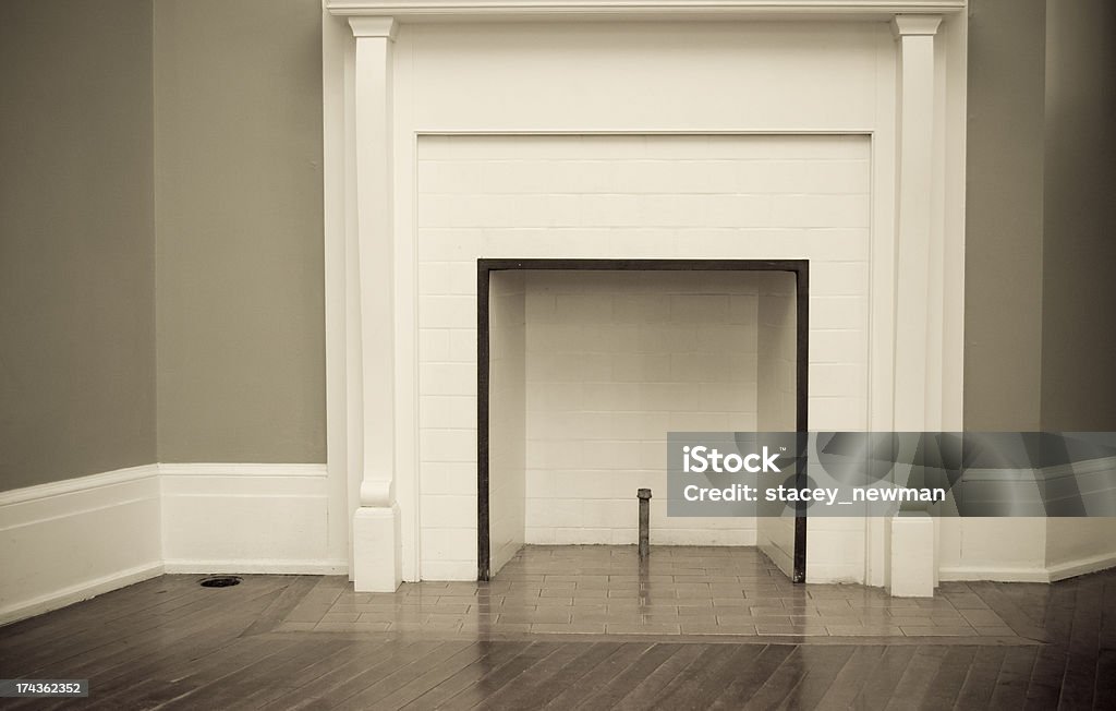 Empty Fireplace An empty fireplace in an old building. Architecture Stock Photo