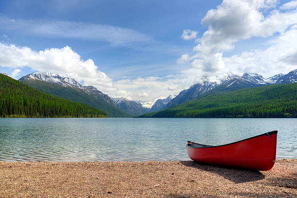 istock Canoe next to a mountain lake 174362678