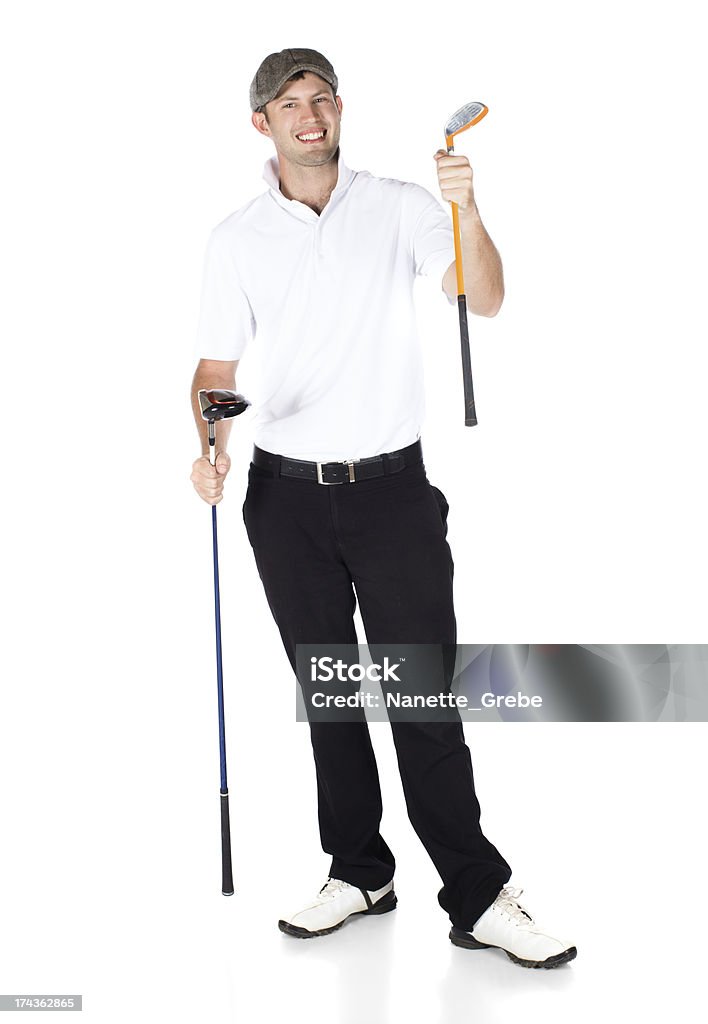 Professional golf player Handsome young professional golf player wearing a white shirt and black pants. He is holding two clubs and smiling at the camera. Adult Stock Photo