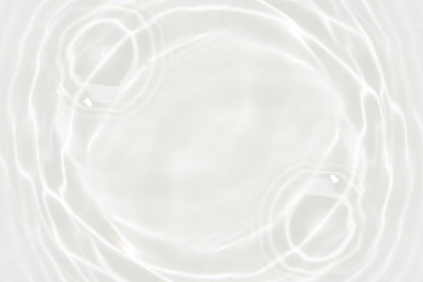 istock Defocus blurred transparent white colored clear calm water surface texture with splashes reflection. Trendy abstract nature background. Water waves in sunlight with copy space. Blue watercolor shine. 1743632673