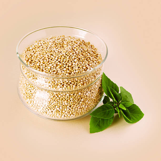 White quinoa in a glass pot stock photo