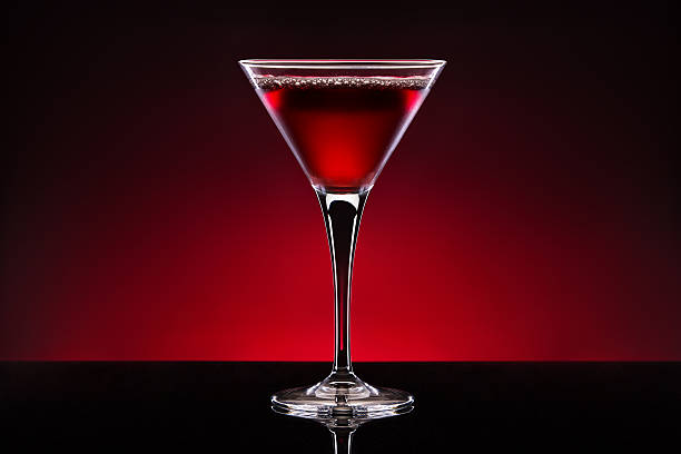 Martini glass over red background stock photo