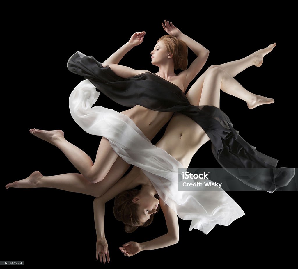 Concept of yin and yang. Sensual girls posing nude Concept of yin and yang. Sensual girls posing nude, isolated on black Adult Stock Photo