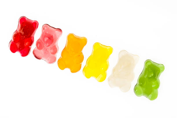 istock Colorful row of jelly bears on white background 174365029