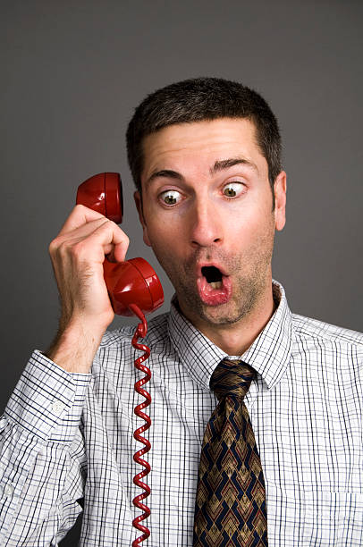 istock Surprised Business Man on Red Telephone 174370458