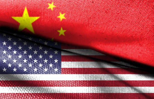 istock The Chinese flag and the American flag are both made from fabric patterns. Conceptual image depicting U.S. hostility toward China. Basemap and background concept. Double exposure hologram. 1743708721