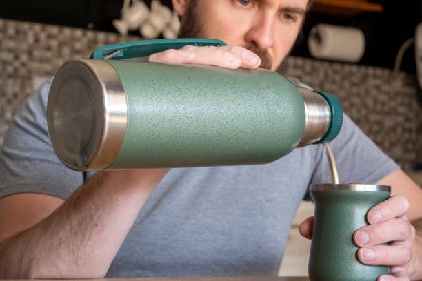istock Latin man drinking mate in the kitchen. 1743710218