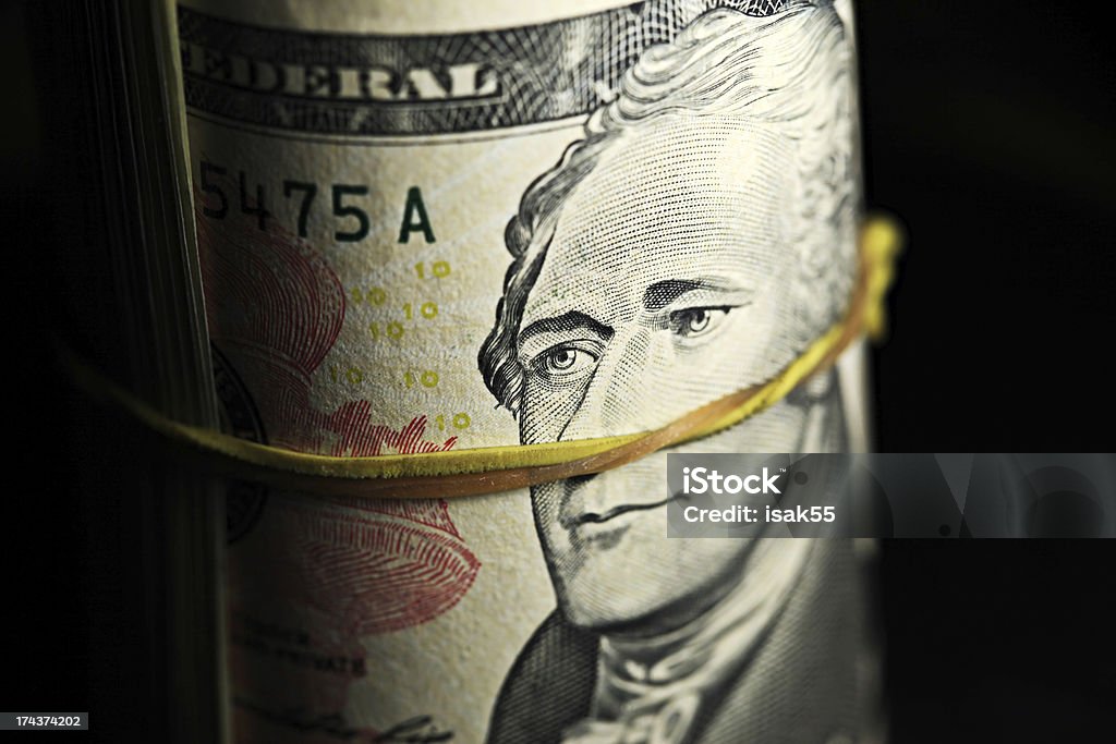 Ten dollars bill in roll. Ten dollars bill in roll. Money concept. Banking Stock Photo