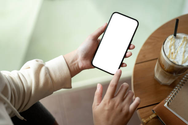 istock Close-up image of a woman using her smartphone while sitting in a coffee shop. 1743753359
