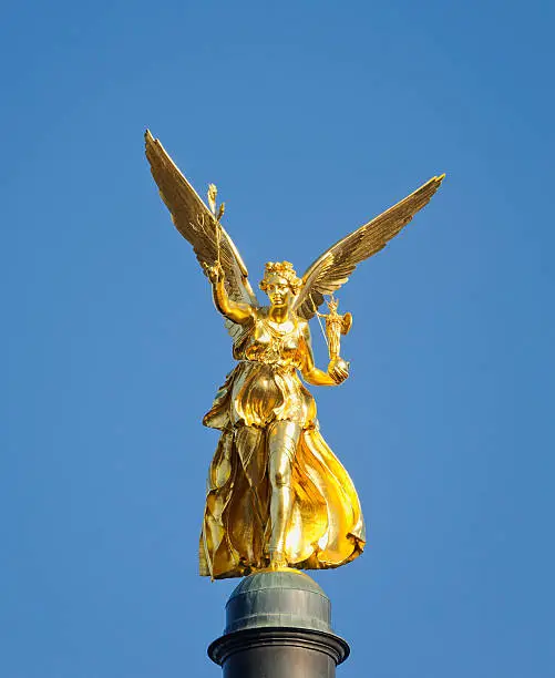 Close-up on the Friedensengel (Angel of Peace) statue in Munich, Germany.  The statue was unveiled in 1899 and stands on a tall column.  It is a replica of the classical Greek Nike of Paionios statue.