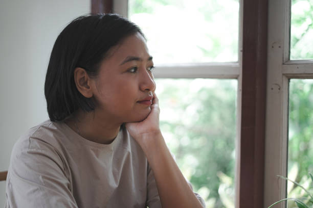 istock Portrait Women Sitting and watching by the window 1743786865