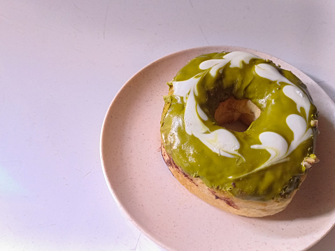 matcha topping donuts on a plate