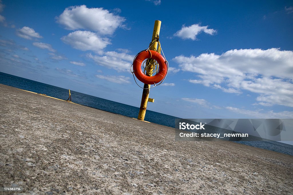 Life Preserver, Tilted Life preserver tilted, pier, lakeshore. Angle Stock Photo