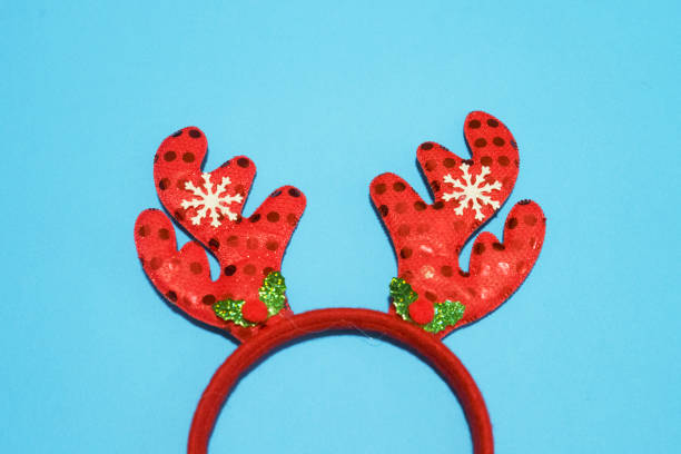 istock Funny Christmas headband and sequins on color background 1743839785