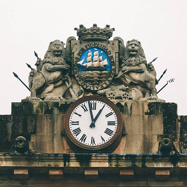 clock and coat of arms on top of the central building in Constitution Square with used to be San Sebastian's City Hall.