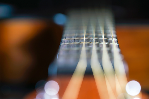 Close up of Guitar with nature background. Customizable space for text or ideas. Copy space.