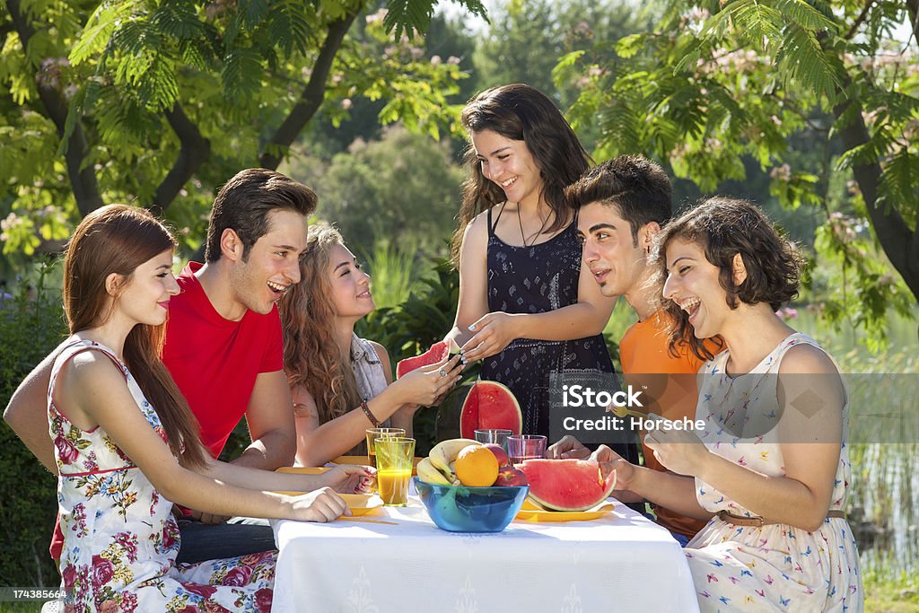 Good times at the park. Good times at the park. Happy friends enjoy the good times at the park Adult Stock Photo