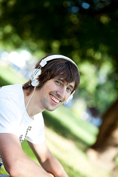 istock Young Cheerful Man Enjoying Music 174386390