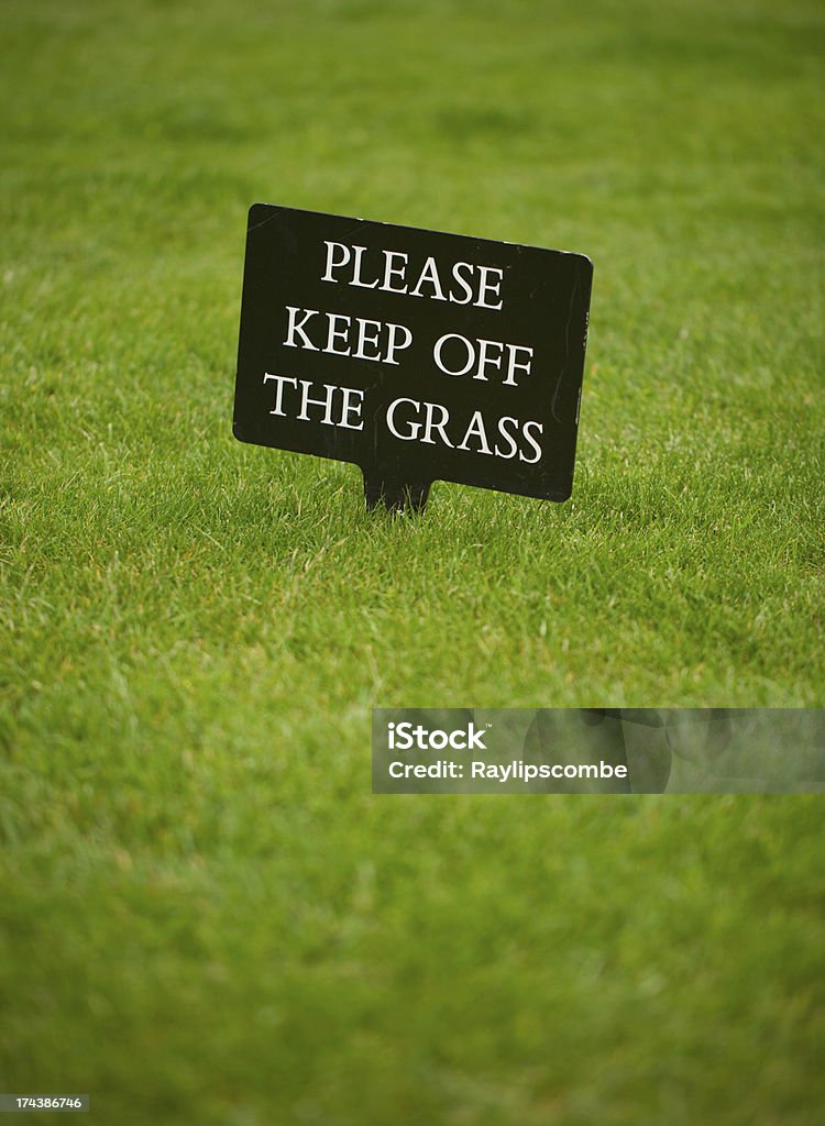 Please keep off the grass sign Keep off the grass sign taken in the grounds of Windsor Castle Keep Off Lawn Sign Stock Photo
