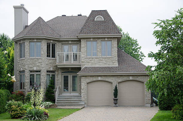 istock Gray stone luxury house surrounded by trees 174388180