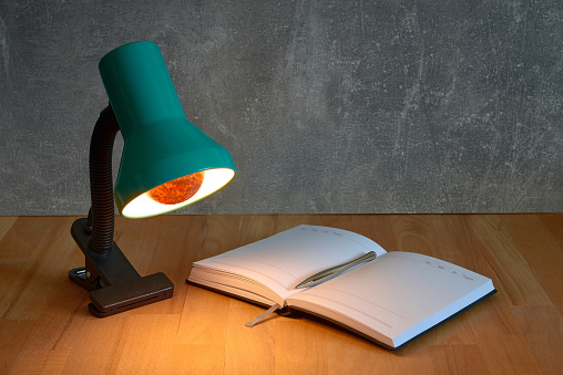 table lamp with notebook and pen mockup