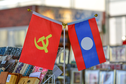 Lao National flag with Communism flag for sale at souvenir shop in Vientiane, Laos.