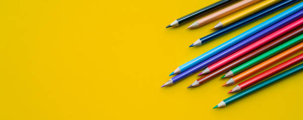 close up group on colored pencil on yellow background for back to school concept