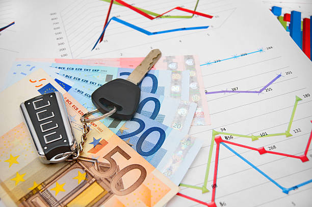 istock Keys from the car, banknote euro on graphs. 174394779