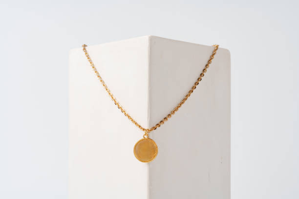 istock Golden pendant on chain on white background studio shot 1743969789
