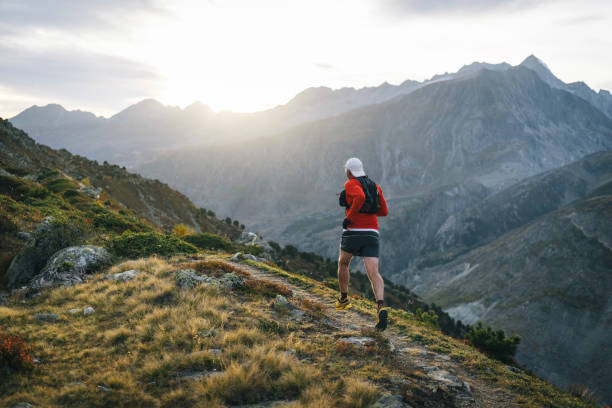 istock Senior male trail runner bounds along mountain trail 1743971433