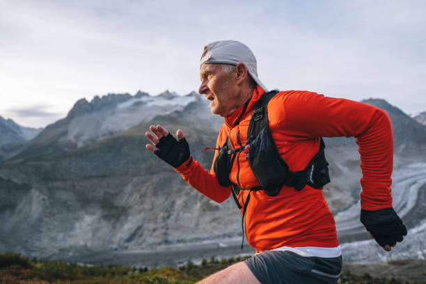 istock Senior male trail runner bounds along mountain trail 1743971434
