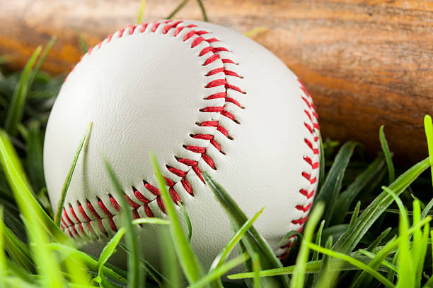 istock New White Baseball in green grass 174397522