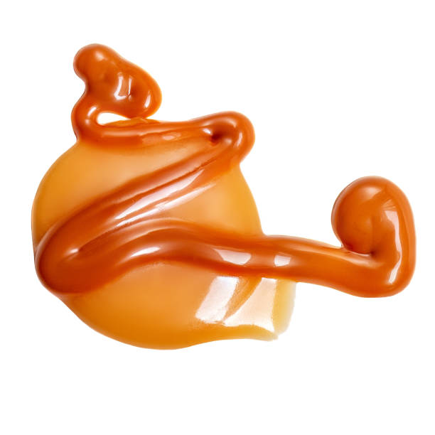 istock Caramel candies with melted caramel isolated on white background. Top view. Flat lay. 1743975376